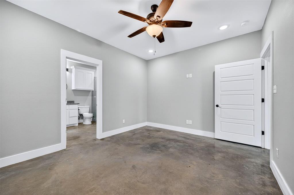 1501 South 7th Avenue Denison, TX 75021 - Photo 21 of 32 an empty room and chandelier fan