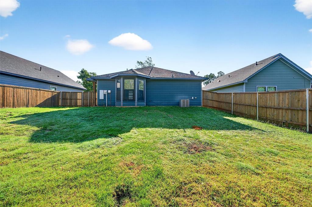1501 South 7th Avenue Denison, TX 75021 - Photo 31 of 32 a view of a house with a yard and sitting area