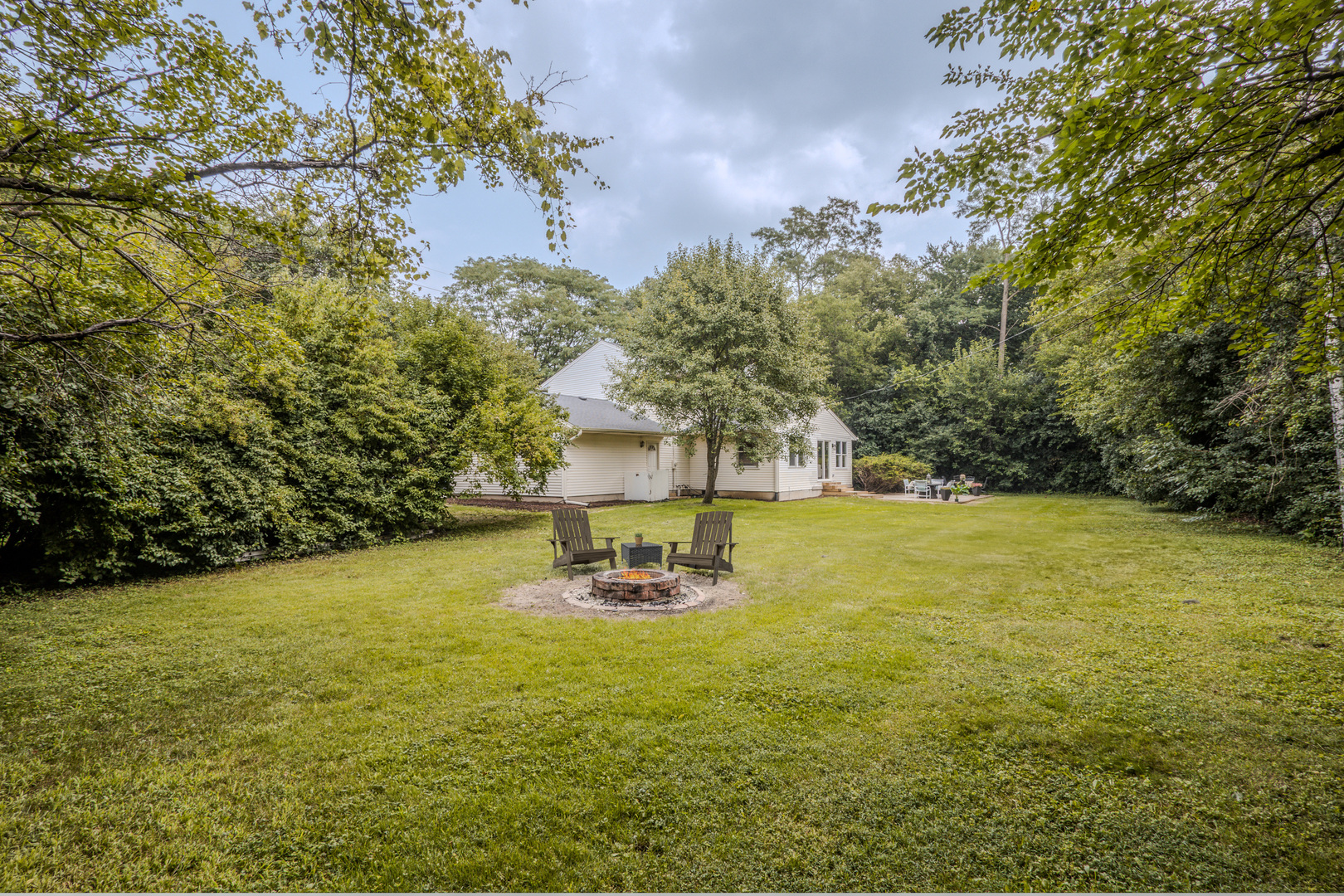 1936 South Street Geneva, IL 60134 - Photo 33 of 34 a view of a swimming pool with an outdoor space and seating area