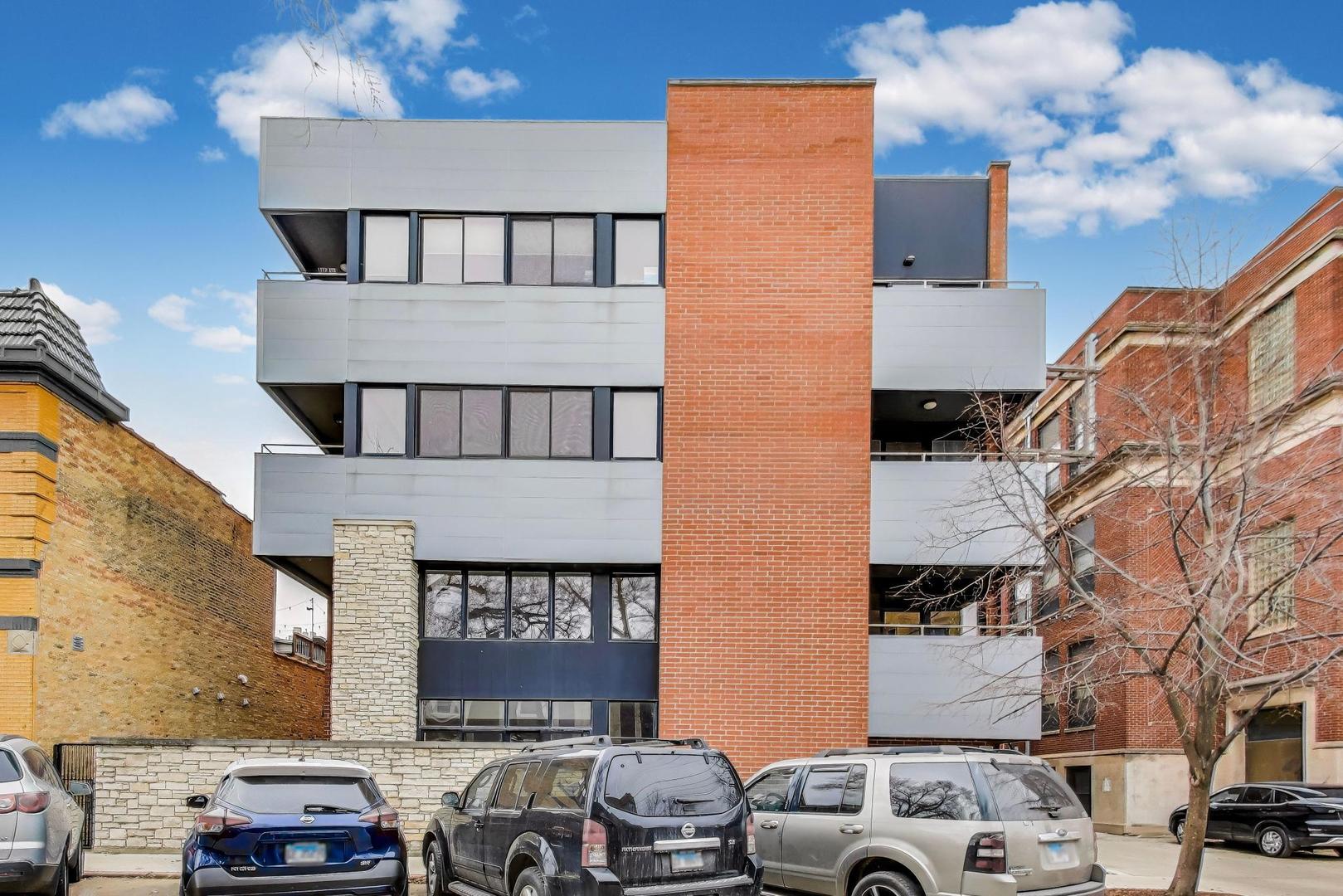 a front view of a building with parking space