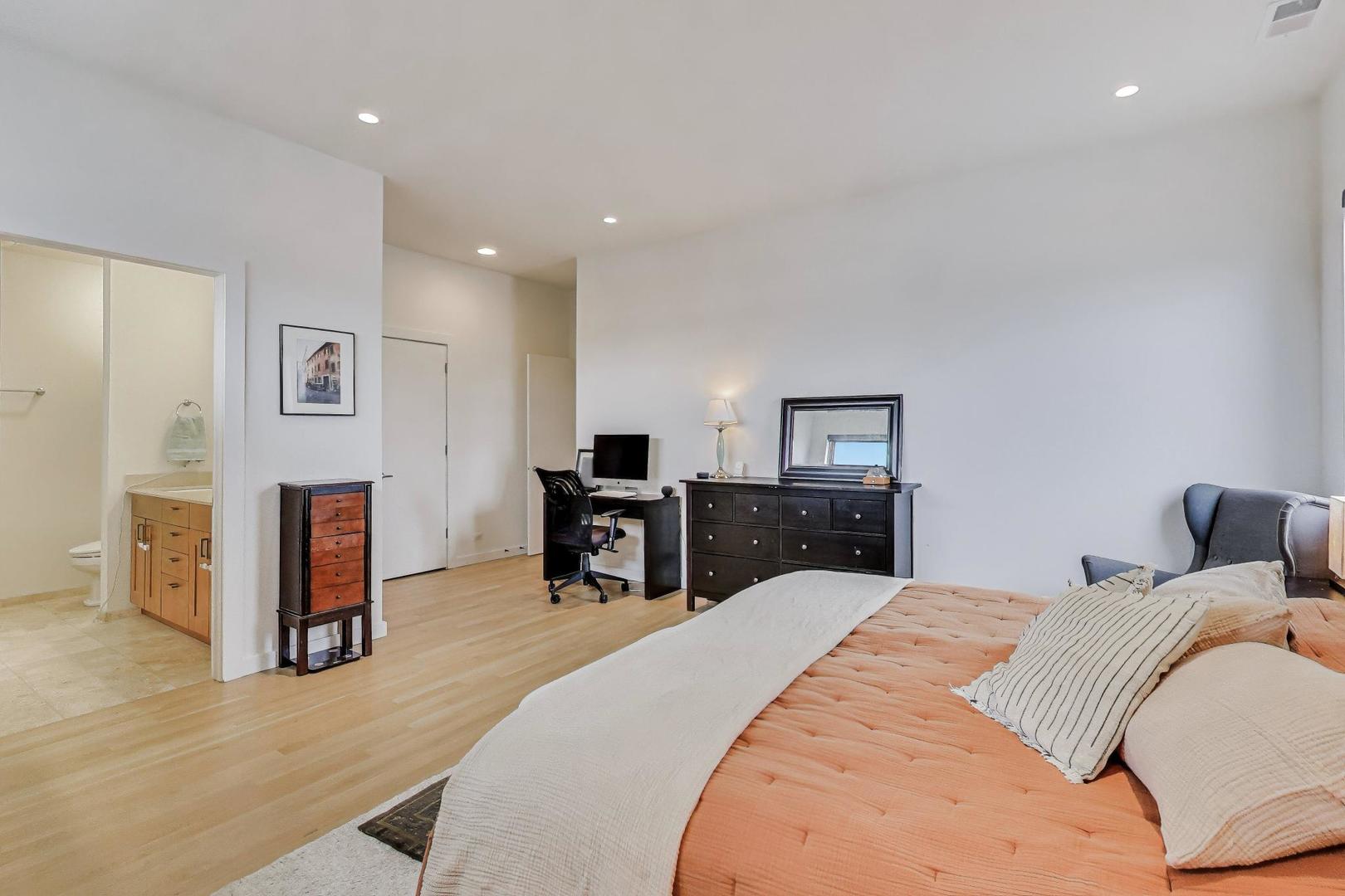 4410 North Troy Street, Unit 301 Chicago, IL 60625 - Photo 12 of 23 a bedroom with a bed and a television