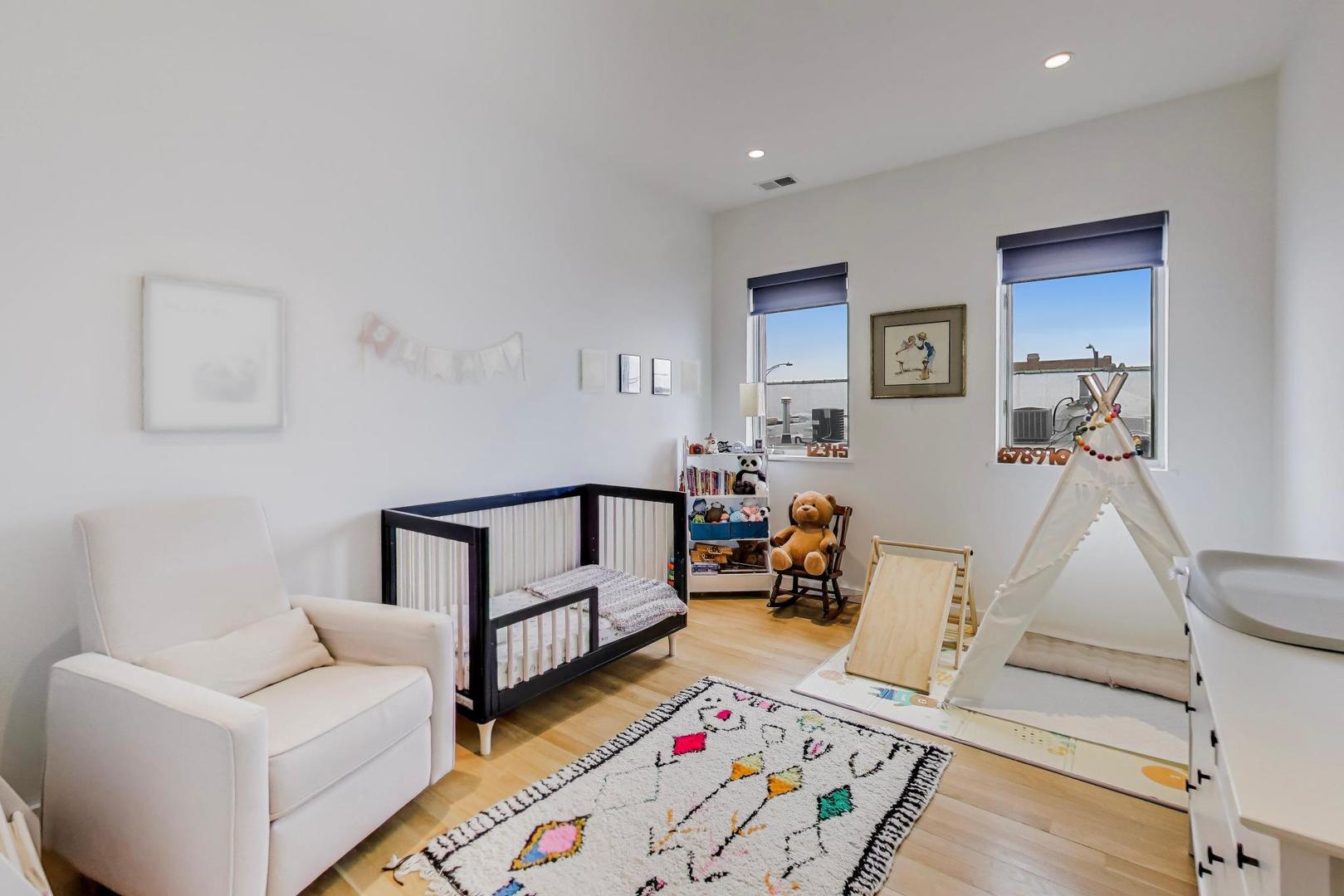 4410 North Troy Street, Unit 301 Chicago, IL 60625 - Photo 16 of 23 a living room with furniture and wooden floor