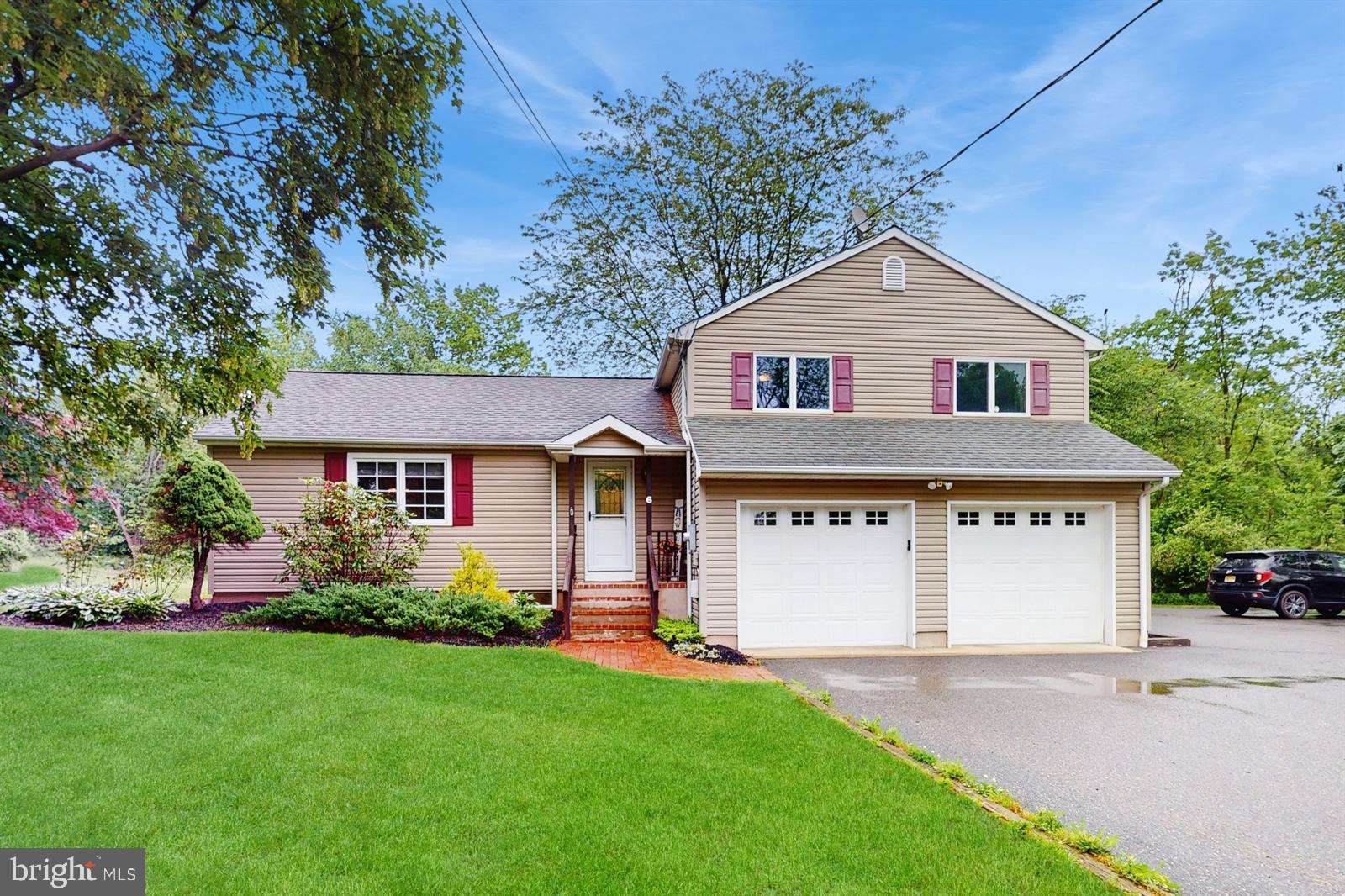 6 John Ringo Road Ringoes, NJ 08551 - Photo 1 of 27 front view of a house with a yard
