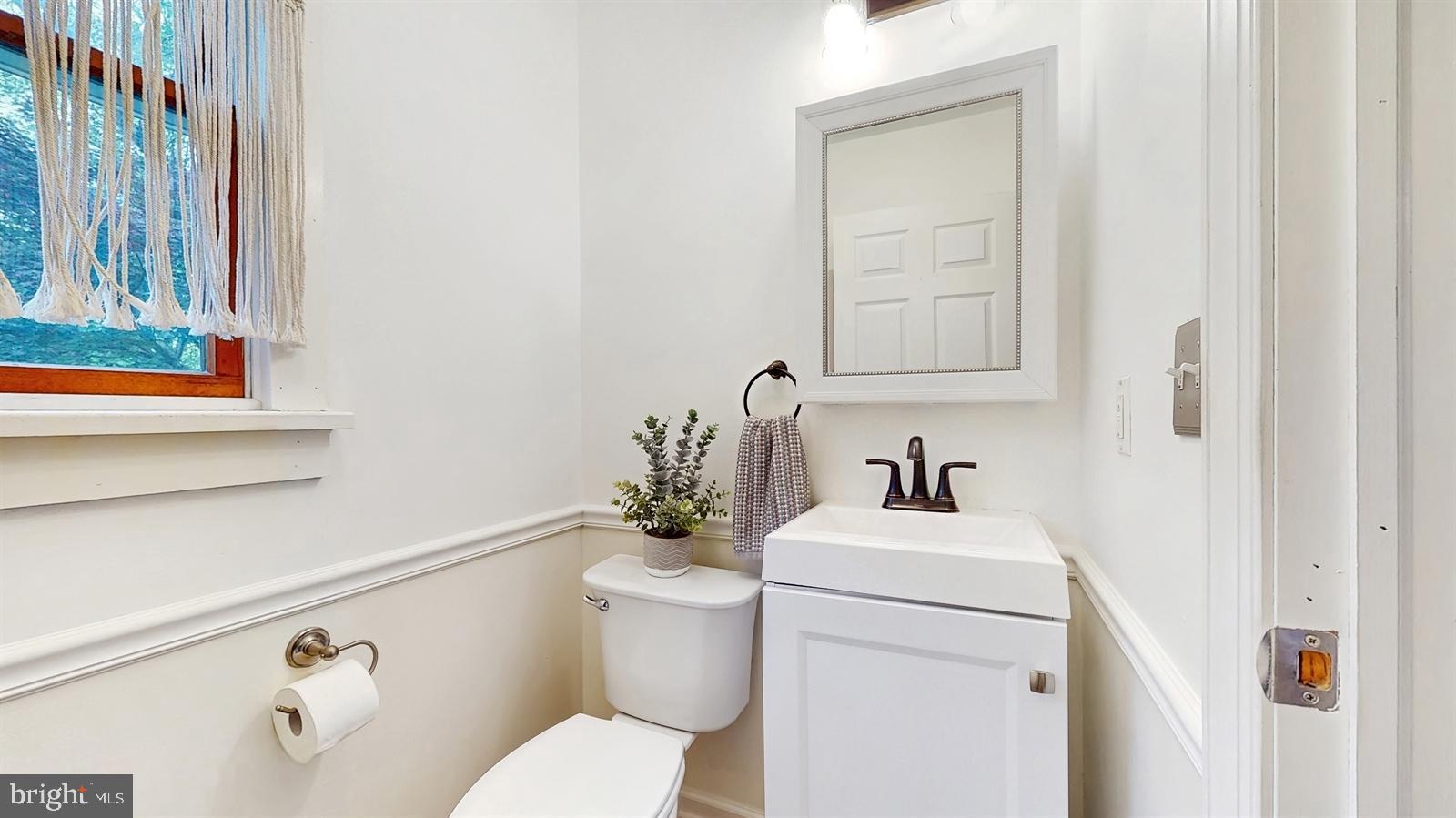 6 John Ringo Road Ringoes, NJ 08551 - Photo 11 of 27 a bathroom with a sink a toilet and a mirror