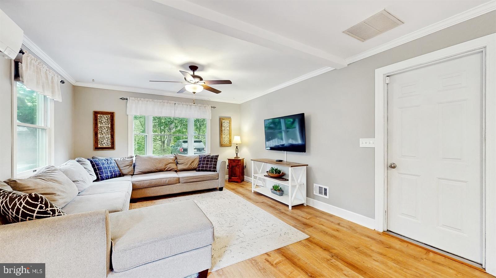 6 John Ringo Road Ringoes, NJ 08551 - Photo 12 of 27 a living room with furniture and a flat screen tv