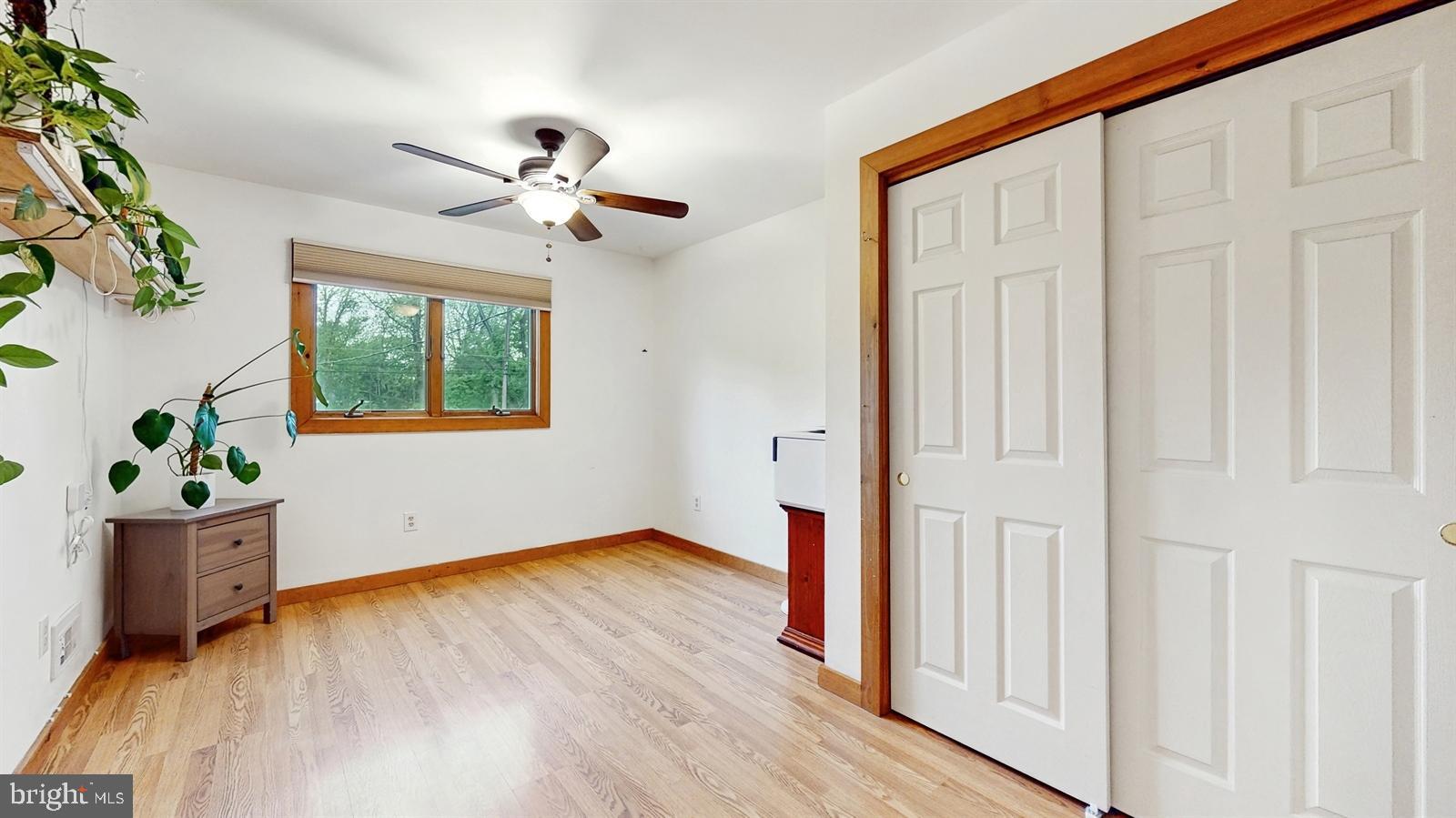 6 John Ringo Road Ringoes, NJ 08551 - Photo 16 of 27 a view of an empty room with wooden floor and a window