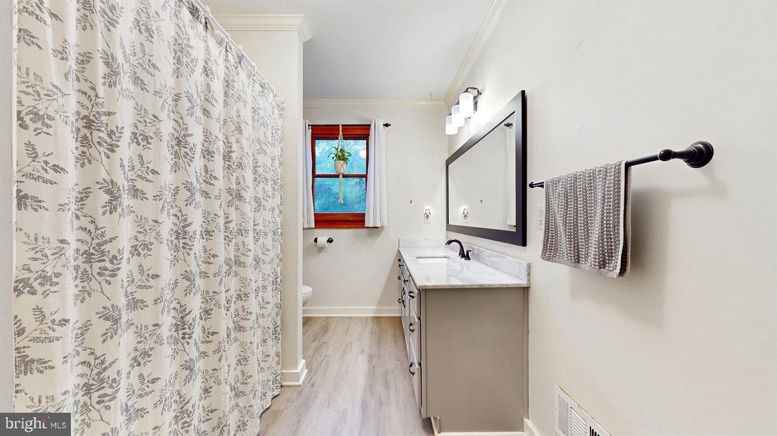 6 John Ringo Road Ringoes, NJ 08551 - Photo 18 of 27 a bathroom with a sink and mirror with bathtub