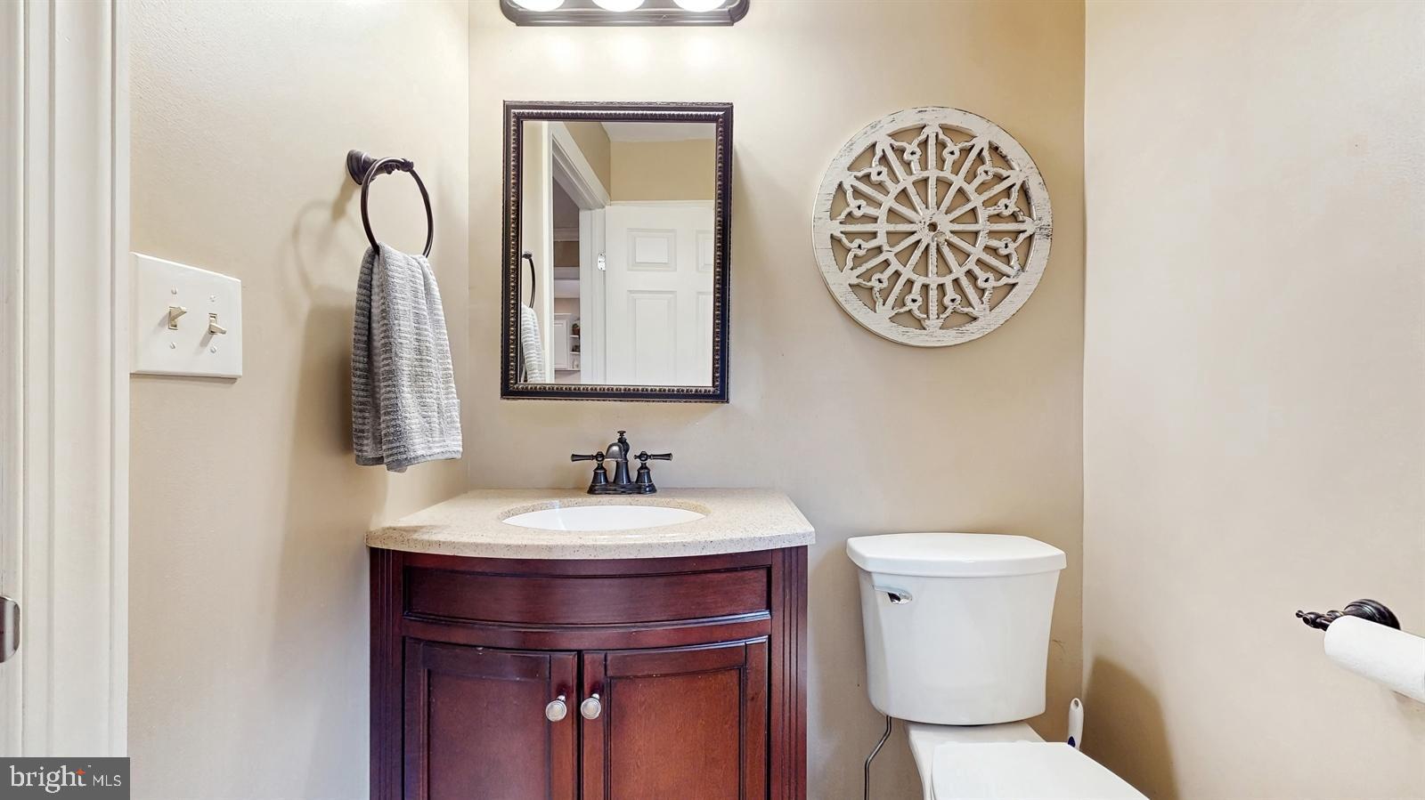 6 John Ringo Road Ringoes, NJ 08551 - Photo 5 of 27 a bathroom with a toilet sink and mirror
