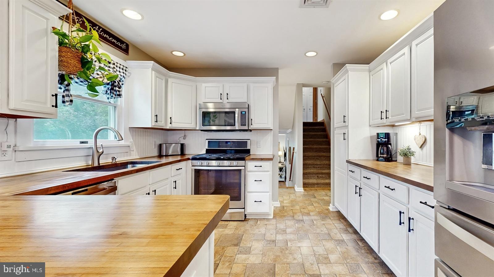6 John Ringo Road Ringoes, NJ 08551 - Photo 7 of 27 a large kitchen with stainless steel appliances granite countertop a stove sink and cabinets