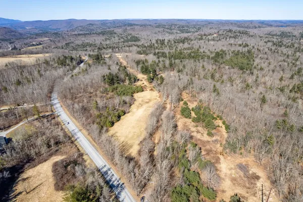 a view of large yard with a house