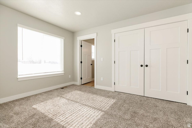 226 South 600 West Logan, UT 84321 - Photo 18 of 25 Unfurnished bedroom featuring a closet, carpet floors, and recessed lighting