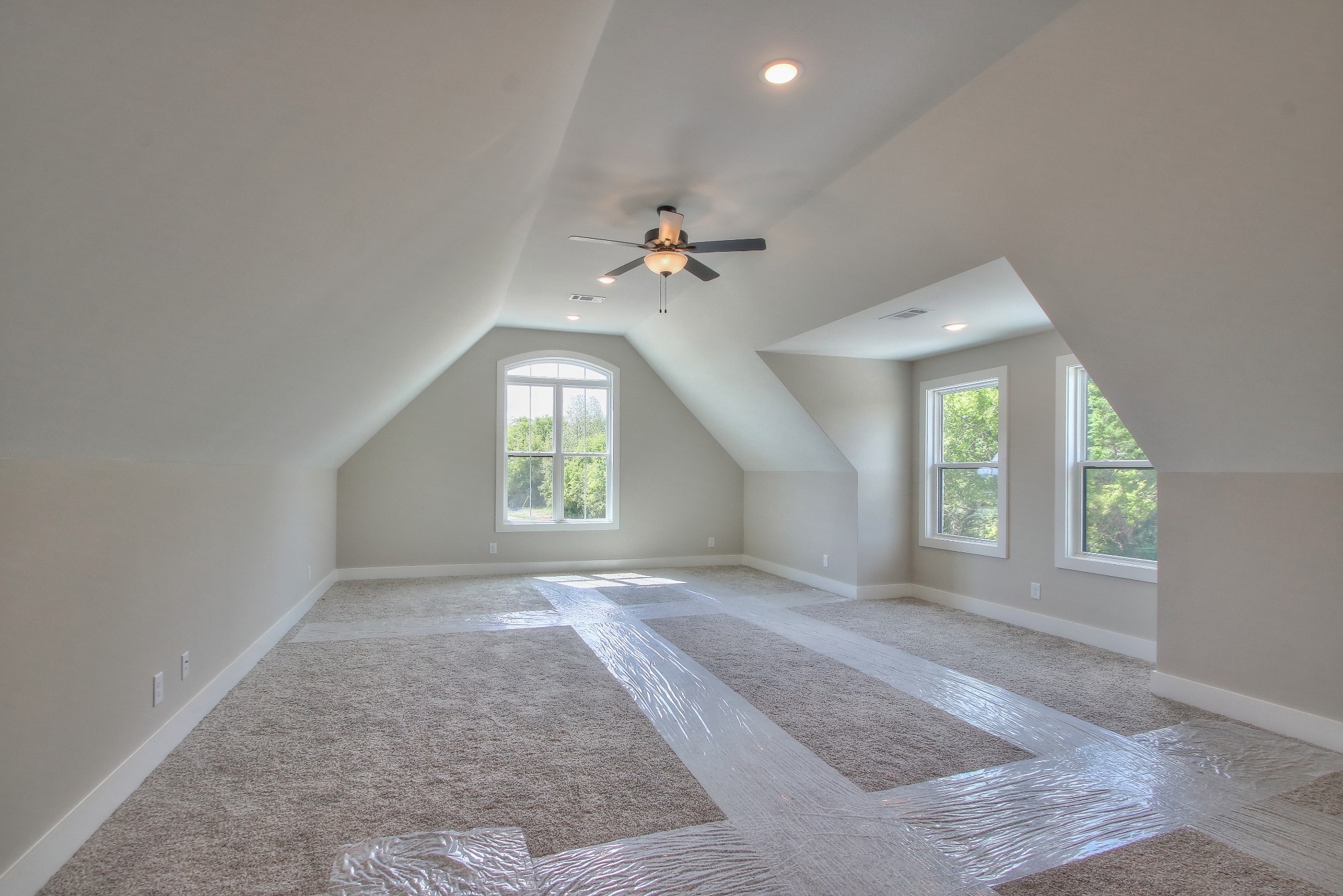 447 Burford Road Lebanon, TN 37087 - Photo 34 of 47 an empty room with windows and a ceiling fan