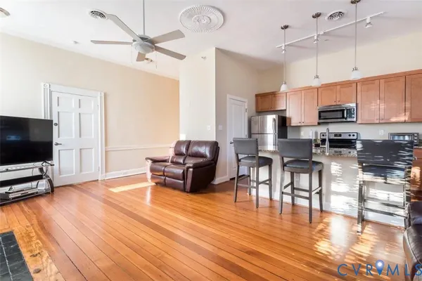 a living room with furniture and a flat screen tv