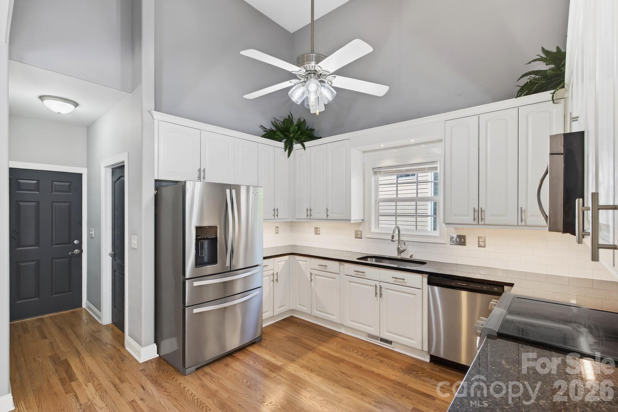 9101 Pitcairn Drive Tega Cay, SC 29708 - Photo 19 of 48 a kitchen with a sink stainless steel appliances and cabinets