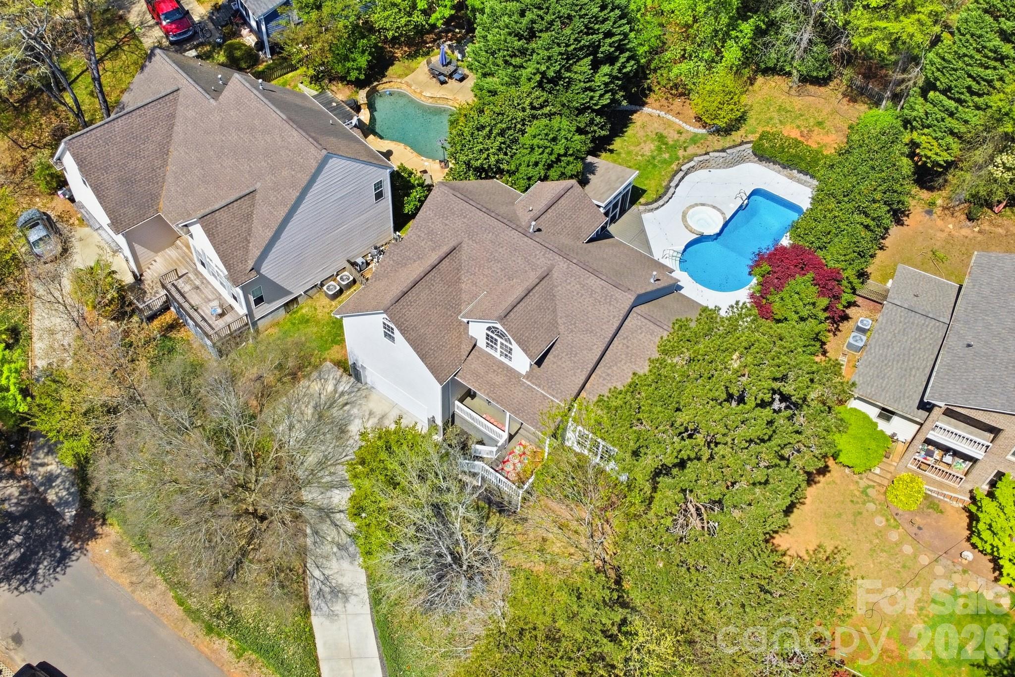 9101 Pitcairn Drive Tega Cay, SC 29708 - Photo 3 of 48 an aerial view of a house with a yard and garden