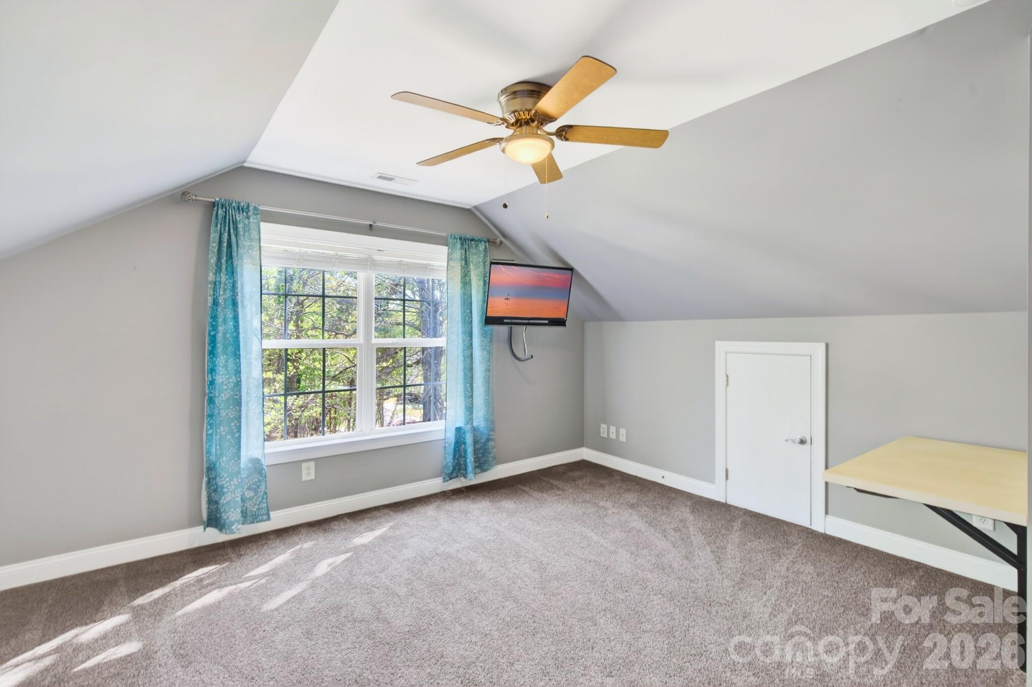 9101 Pitcairn Drive Tega Cay, SC 29708 - Photo 31 of 48 a view of an empty room with a window