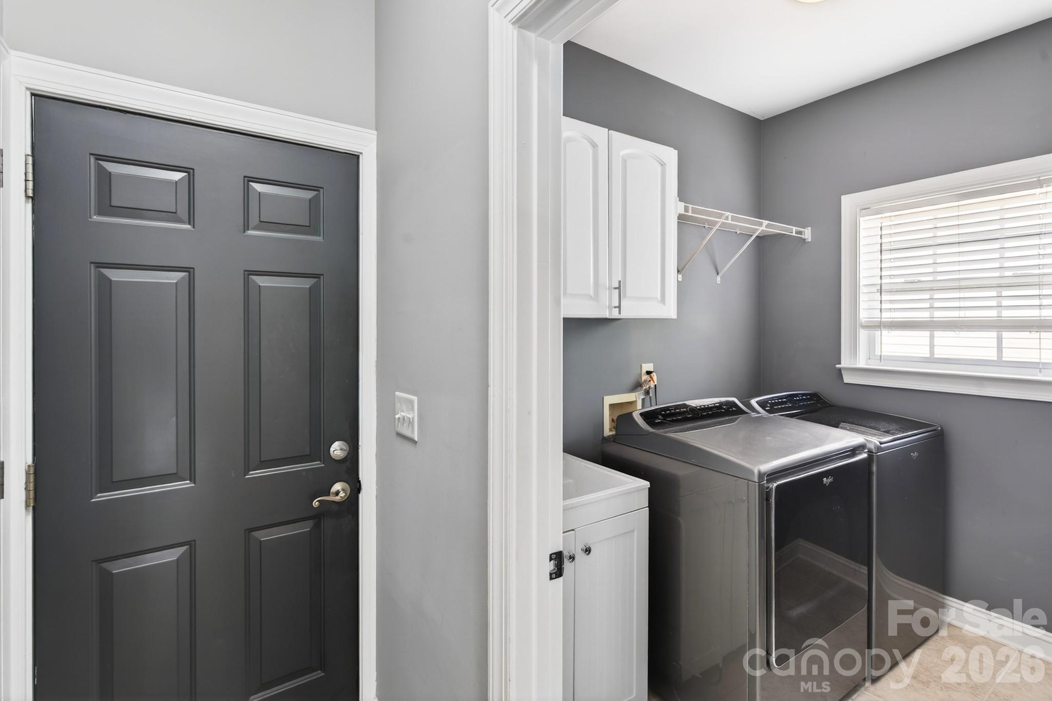 9101 Pitcairn Drive Tega Cay, SC 29708 - Photo 34 of 48 a utility room with closet dryer and washer