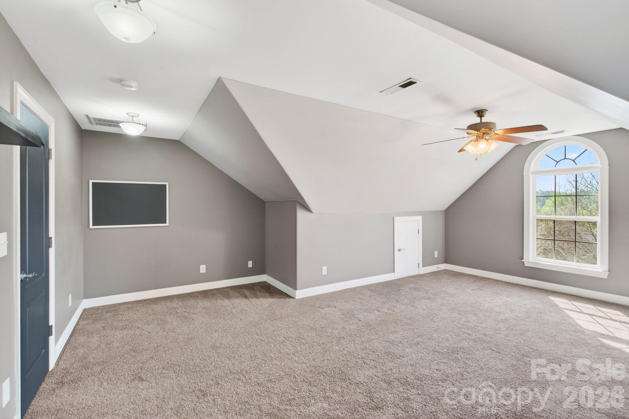 9101 Pitcairn Drive Tega Cay, SC 29708 - Photo 35 of 48 a view of an empty room with a window
