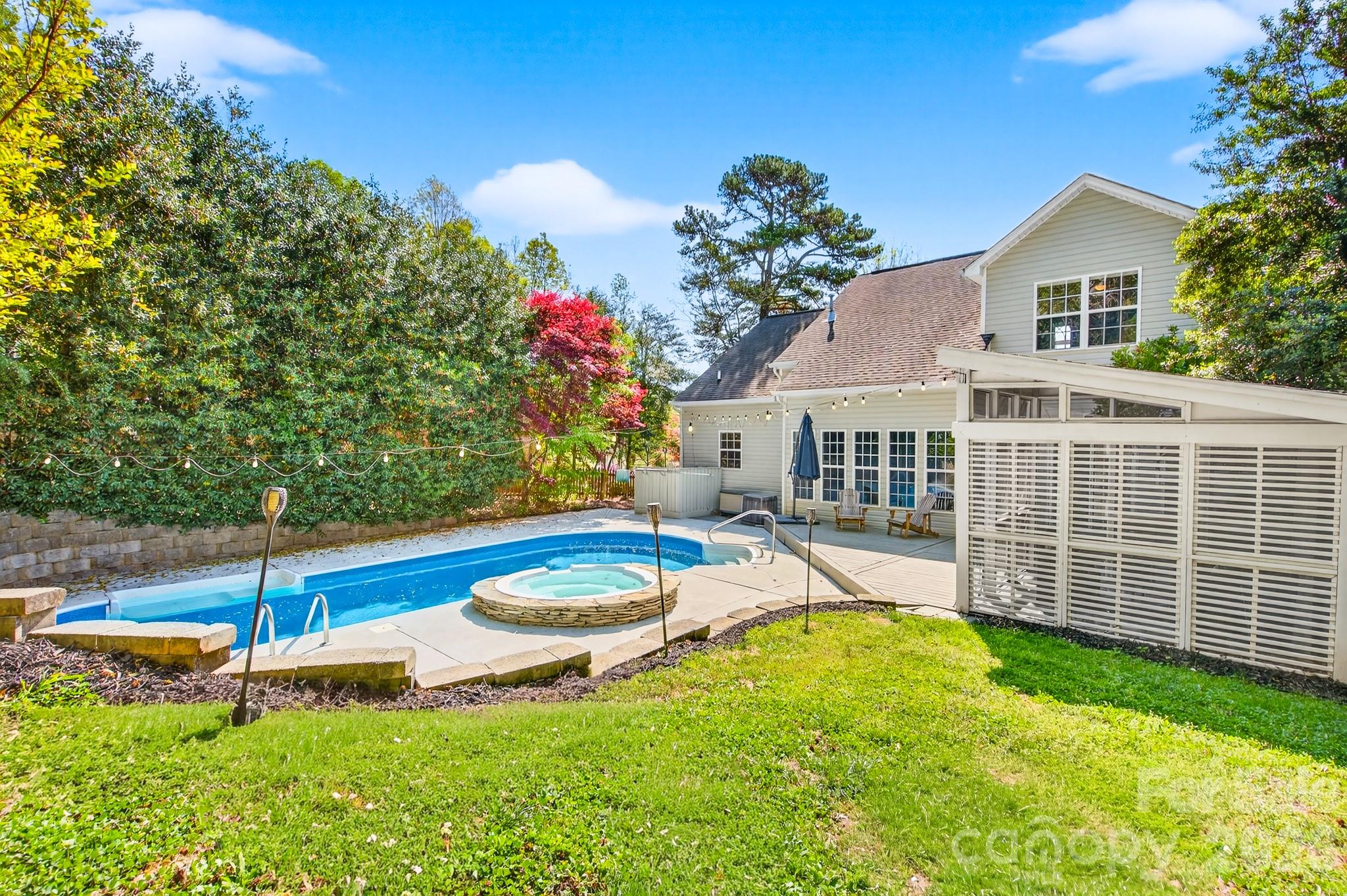 9101 Pitcairn Drive Tega Cay, SC 29708 - Photo 41 of 48 a view of a house with backyard and sitting area