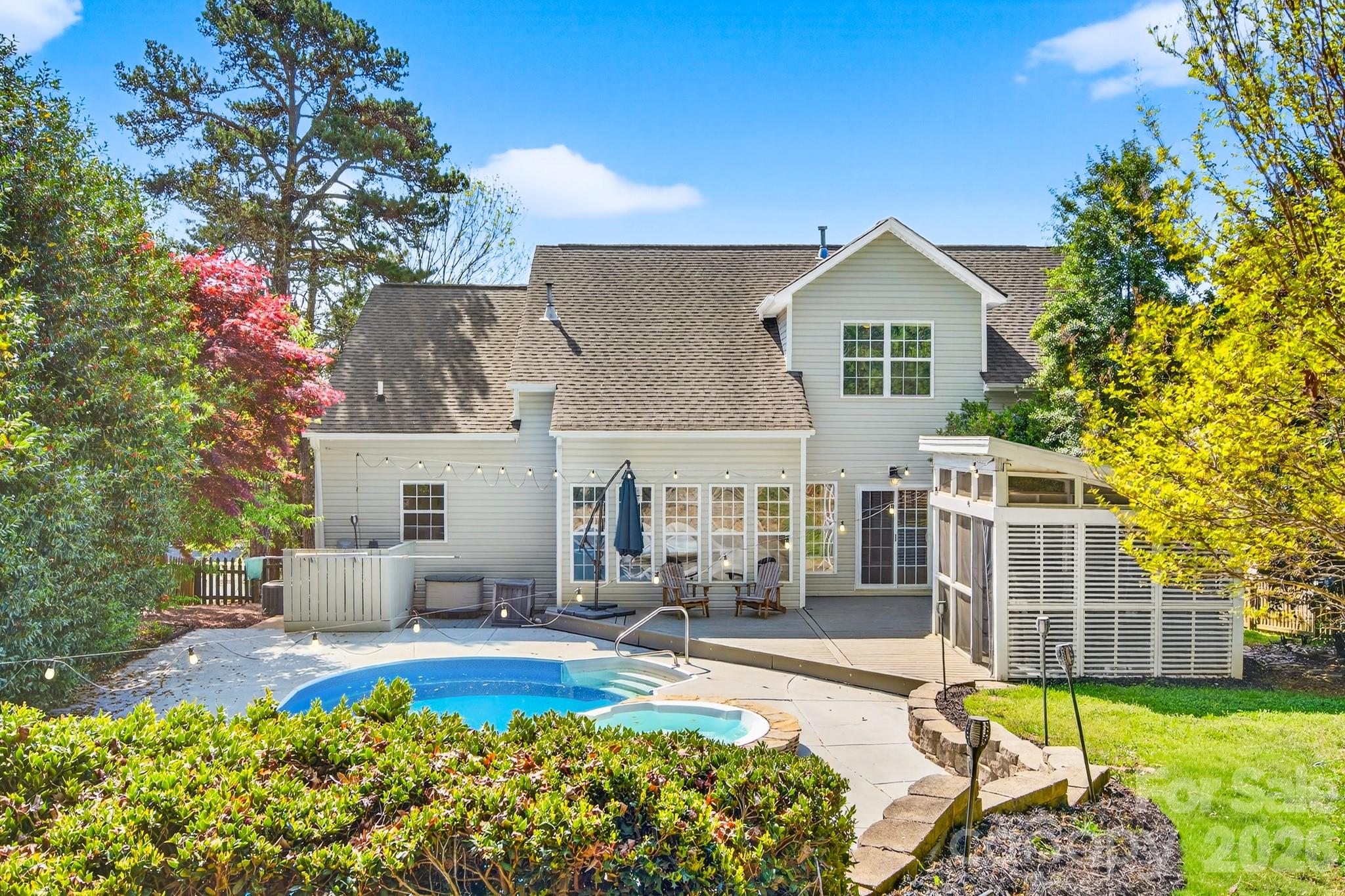 9101 Pitcairn Drive Tega Cay, SC 29708 - Photo 42 of 48 a front view of house with yard and outdoor seating