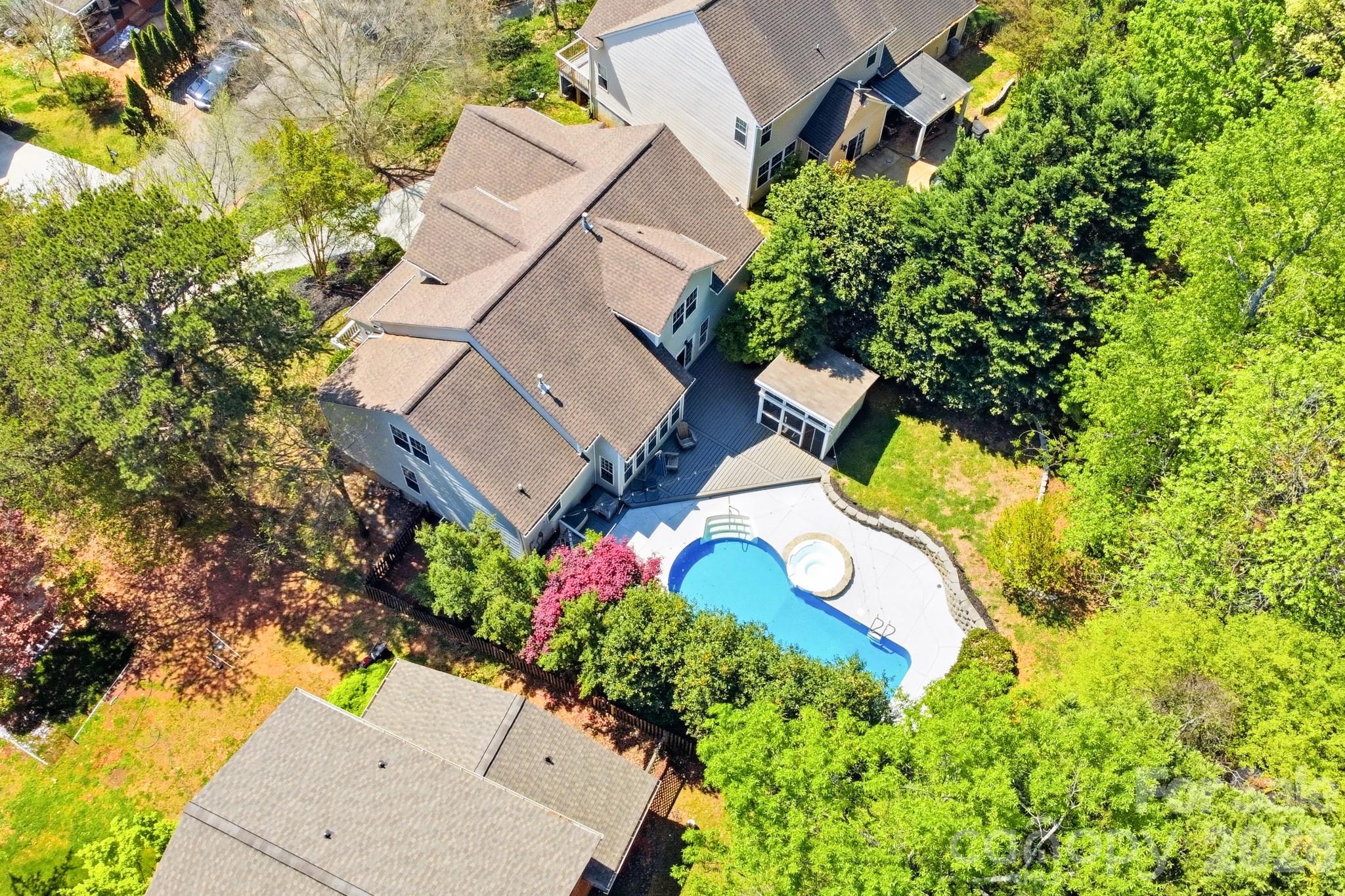 9101 Pitcairn Drive Tega Cay, SC 29708 - Photo 44 of 48 an aerial view of a house with a yard and garden