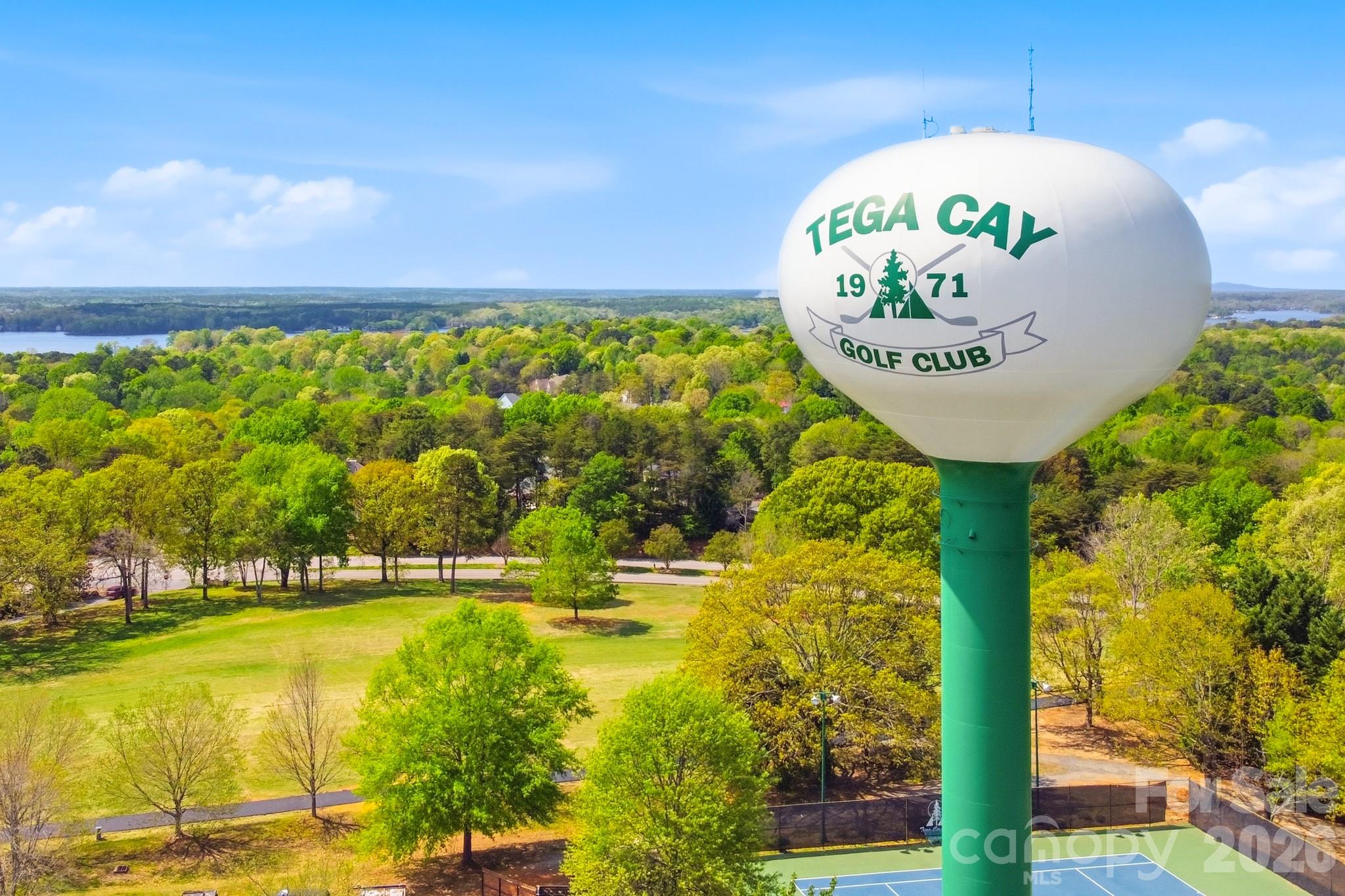 9101 Pitcairn Drive Tega Cay, SC 29708 - Photo 48 of 48 a view of a swimming pool with a patio