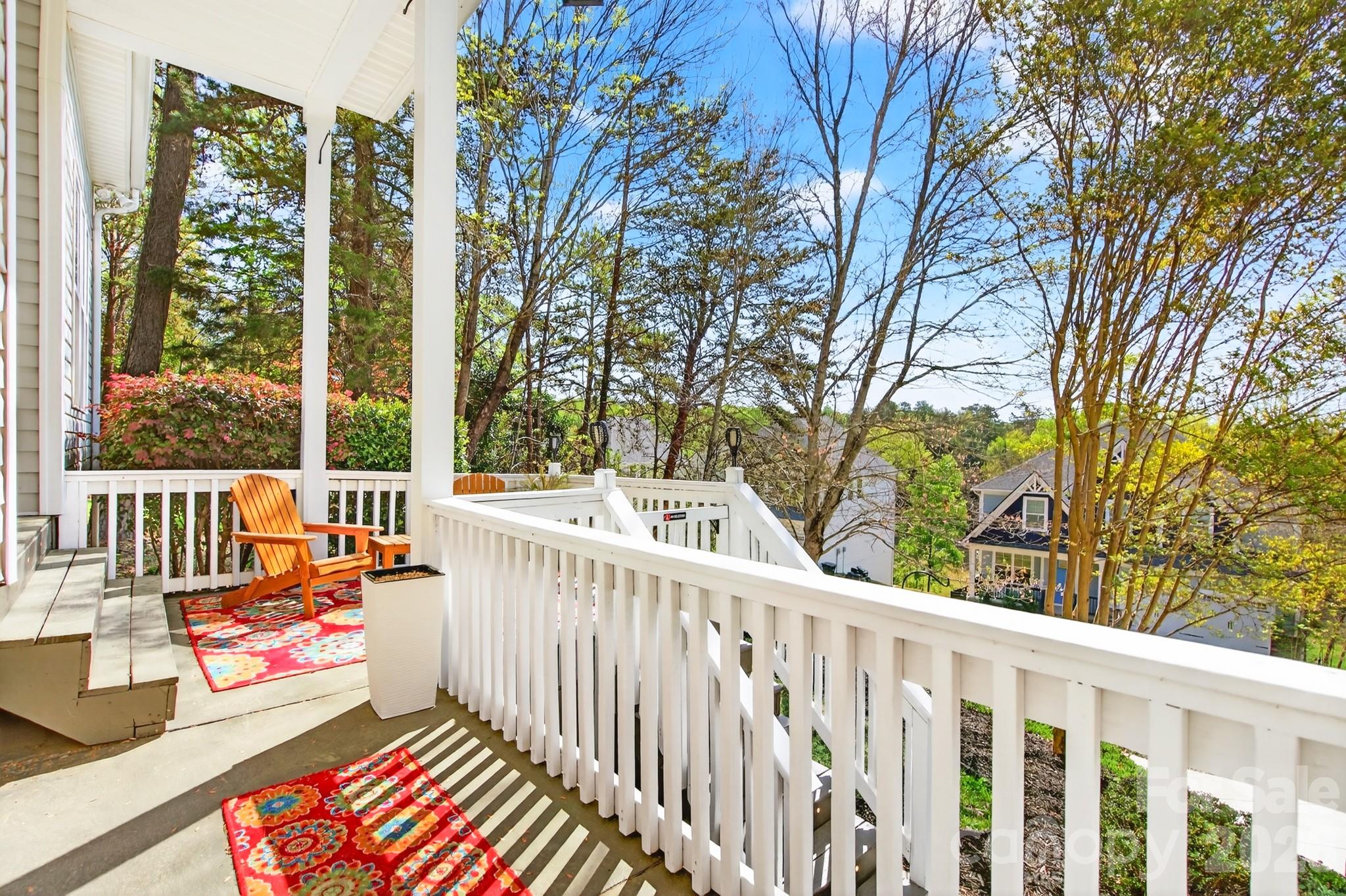 9101 Pitcairn Drive Tega Cay, SC 29708 - Photo 5 of 48 a view of balcony with wooden floor and fence