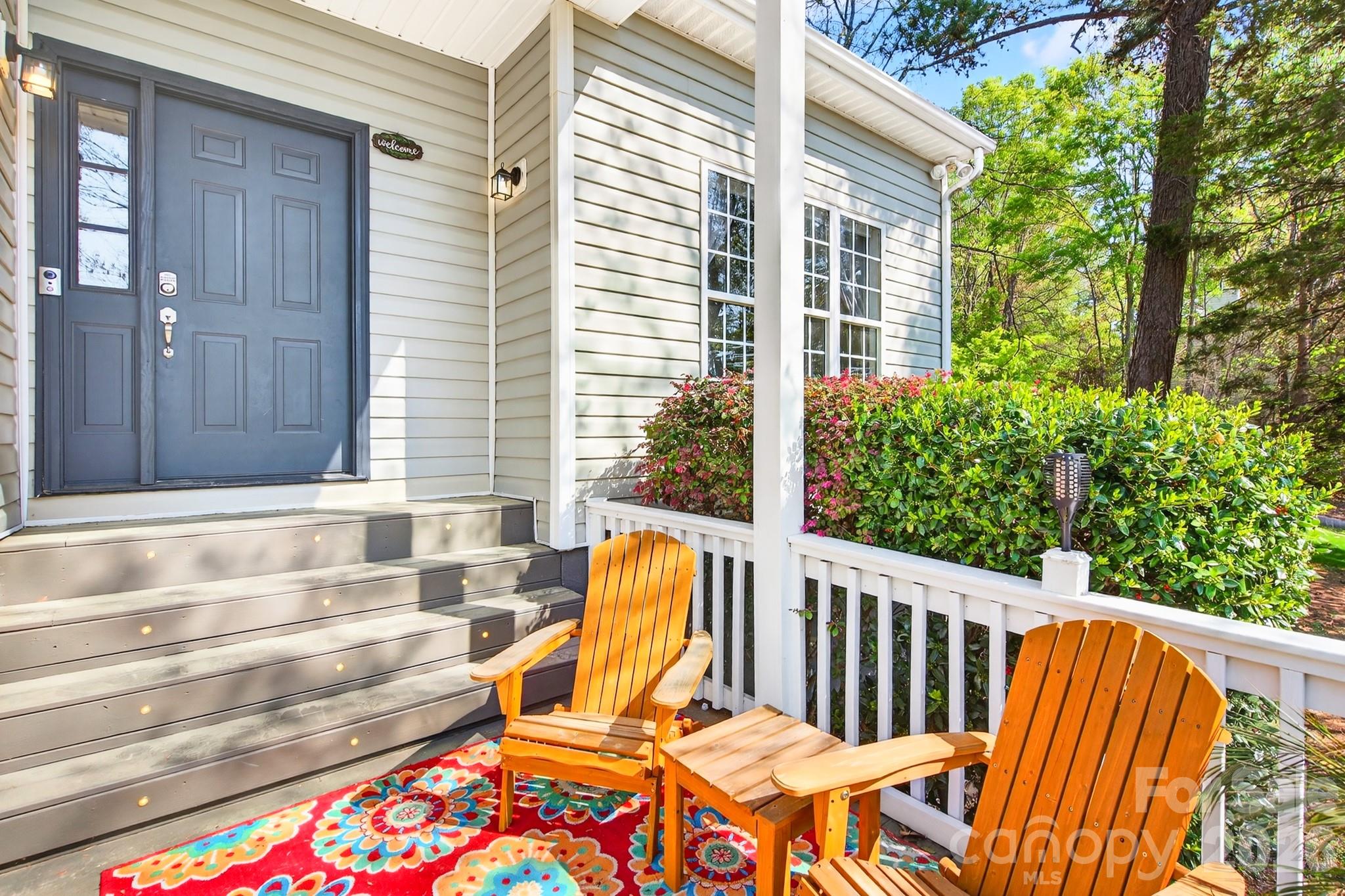 9101 Pitcairn Drive Tega Cay, SC 29708 - Photo 6 of 48 a view of two chairs in the balcony