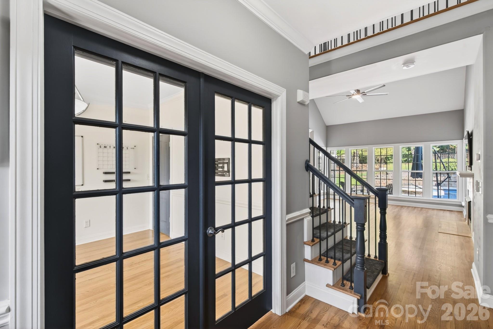 9101 Pitcairn Drive Tega Cay, SC 29708 - Photo 7 of 48 a view of staircase with large window