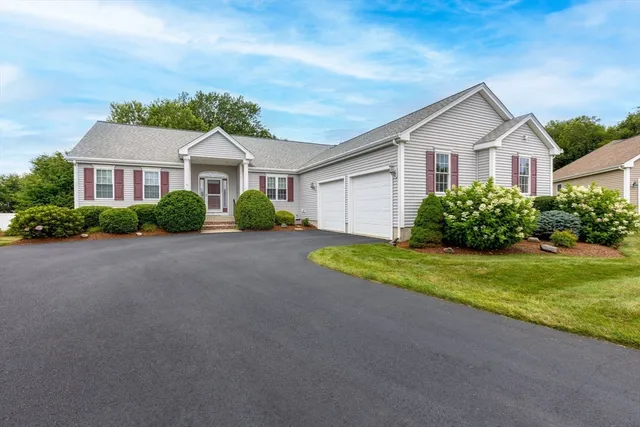 a view of front of house with a yard