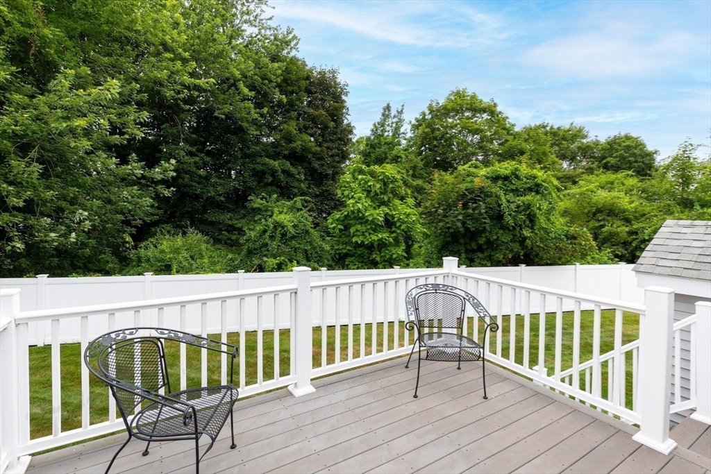 11 Deirdre Circle, Unit 11 Rehoboth, MA 02769 - Photo 12 of 17 a view of balcony with wooden floor and outdoor seating