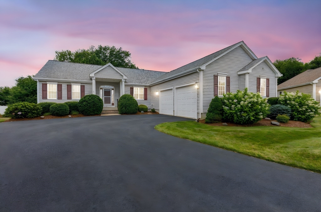 11 Deirdre Circle, Unit 11 Rehoboth, MA 02769 - Photo 17 of 17 a front view of a house with a yard and garage