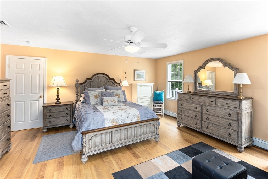 11 Deirdre Circle, Unit 11 Rehoboth, MA 02769 - Photo 7 of 17 a bedroom with a bed and a dresser