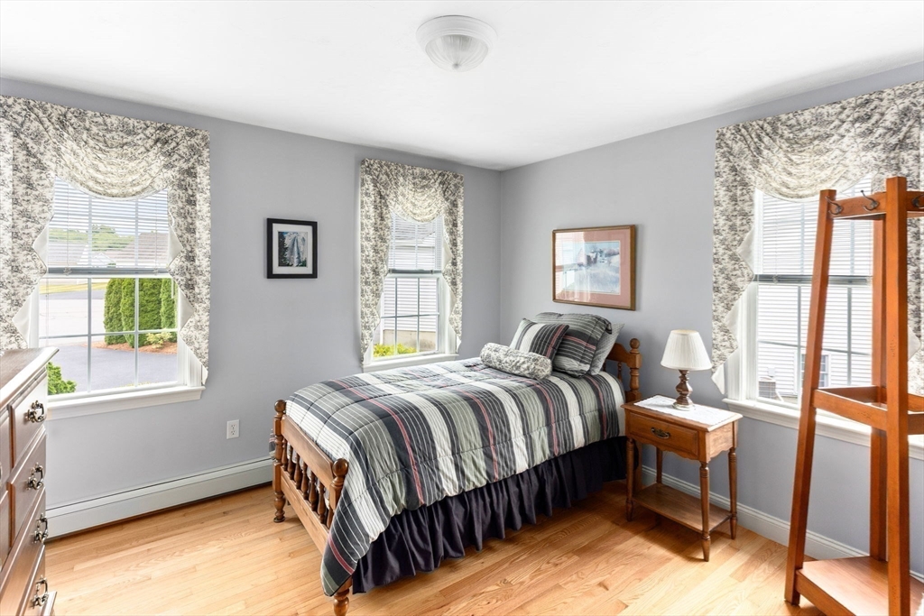 11 Deirdre Circle, Unit 11 Rehoboth, MA 02769 - Photo 8 of 17 a bedroom with a bed and a window