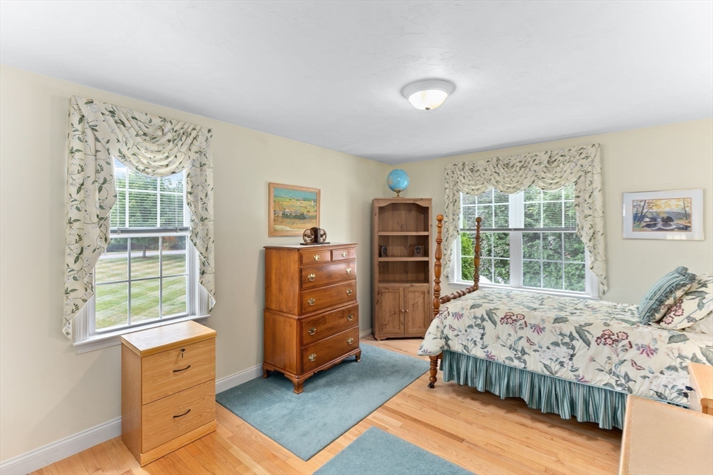 11 Deirdre Circle, Unit 11 Rehoboth, MA 02769 - Photo 9 of 17 a bedroom with furniture and windows
