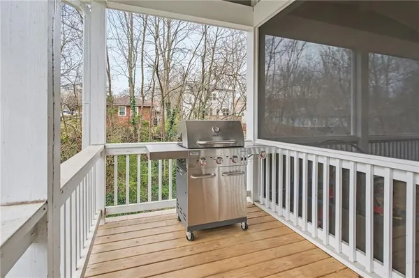 a view of a balcony with wooden floor