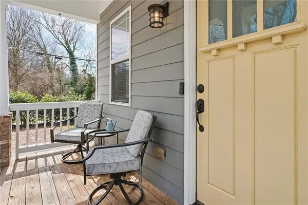 a view of a balcony with chairs