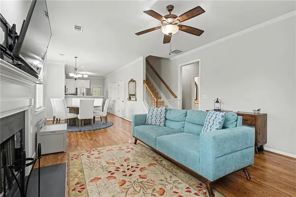 a living room with furniture and a fireplace
