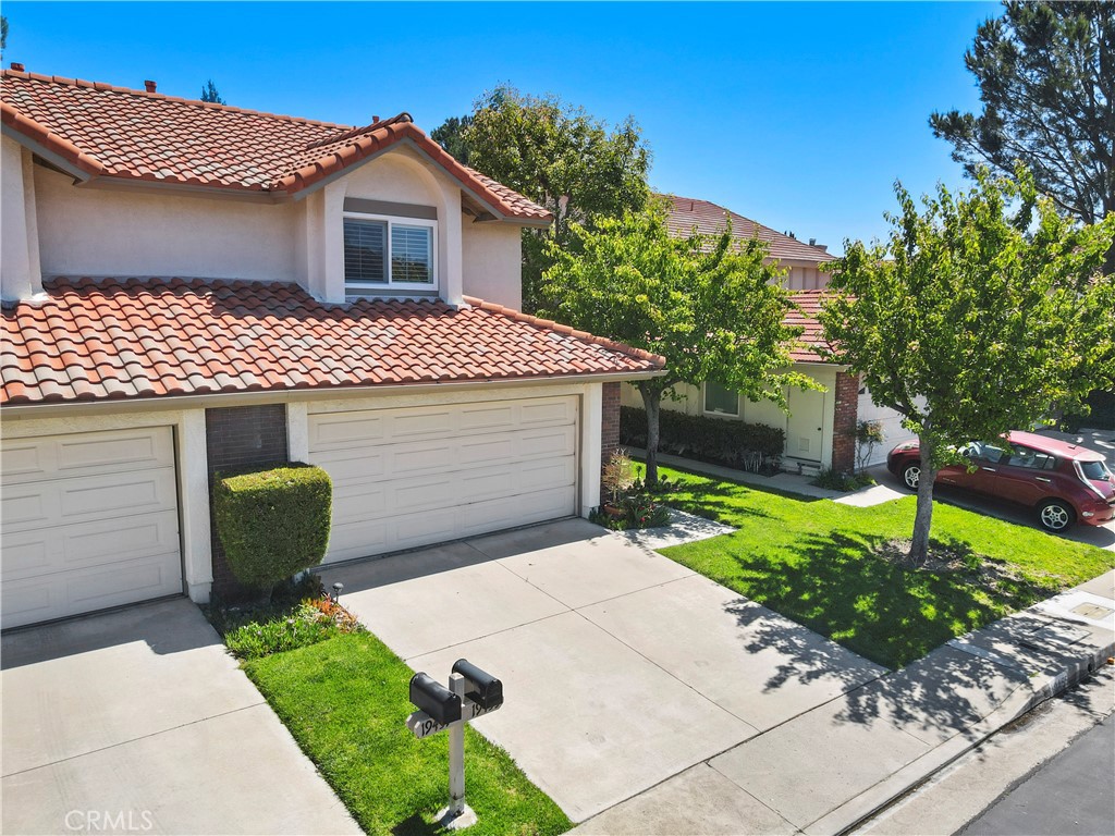 19455 Eagle Ridge Lane Porter Ranch, CA 91326 - Photo 1 of 1 a front view of a house with a yard and garage