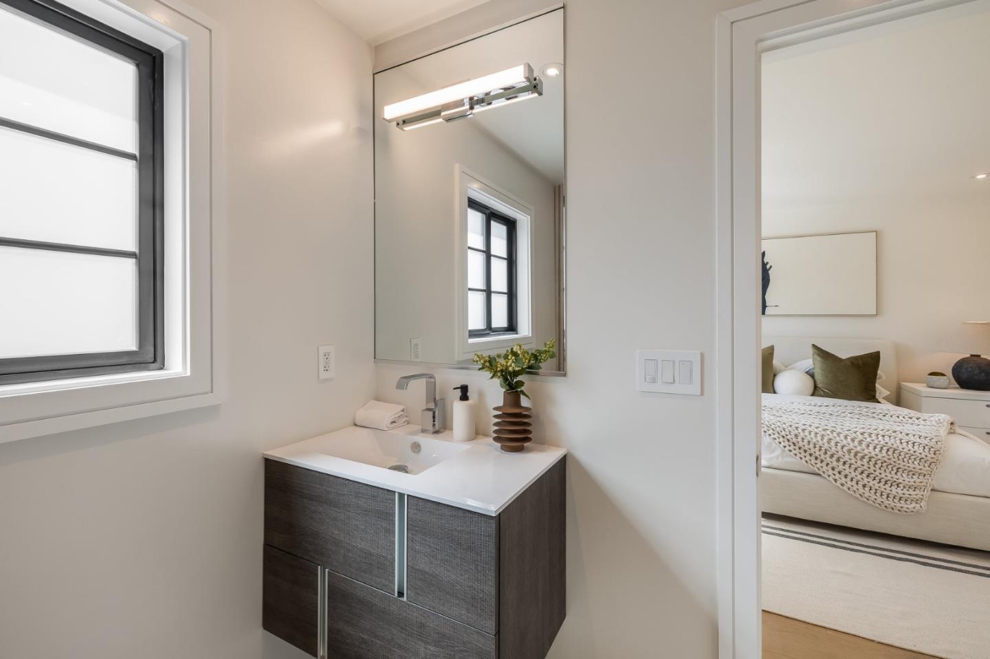 139 Victoria Road Burlingame, CA 94010 - Photo 54 of 72 a bathroom with a sink vanity and mirror