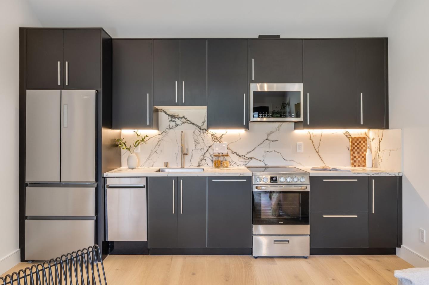 139 Victoria Road Burlingame, CA 94010 - Photo 62 of 72 a kitchen with stainless steel appliances kitchen island a refrigerator sink and stove