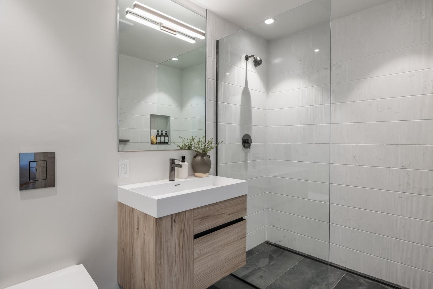 139 Victoria Road Burlingame, CA 94010 - Photo 63 of 72 a bathroom with a sink a toilet a mirror and shower