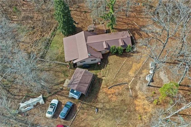 an aerial view of houses with yard