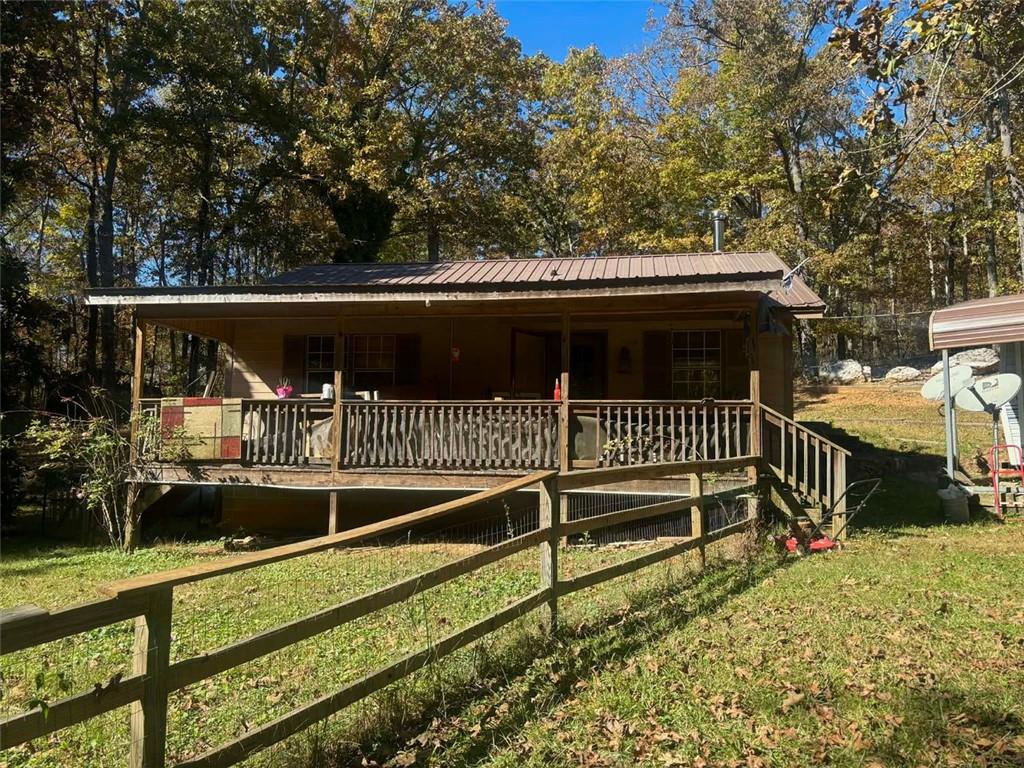 80 Beaver Run Road Waco, GA 30182 - Photo 11 of 17 a view of a chair and table on the deck