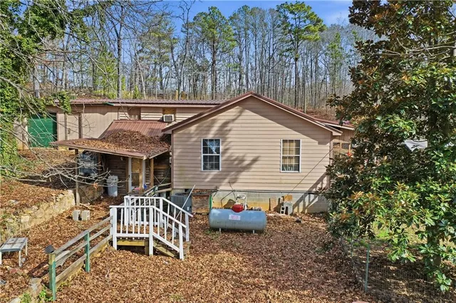 a view of house with a outdoor seating