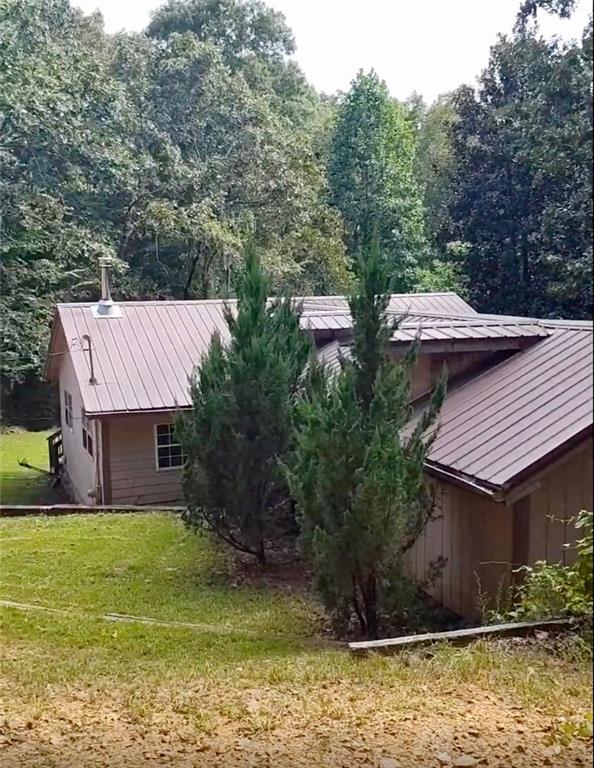80 Beaver Run Road Waco, GA 30182 - Photo 3 of 17 a view of a house with backyard and sitting area