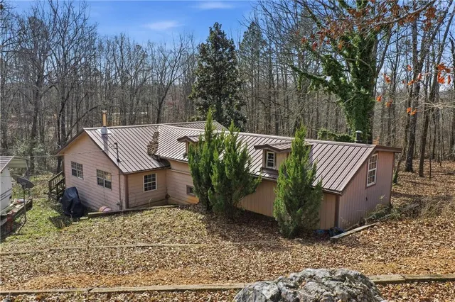a view of a backyard with sitting area