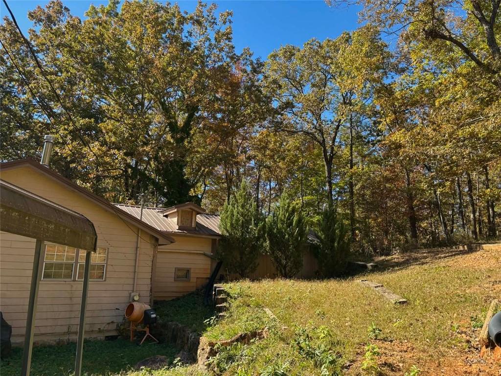 80 Beaver Run Road Waco, GA 30182 - Photo 5 of 17 a view of a backyard of the house