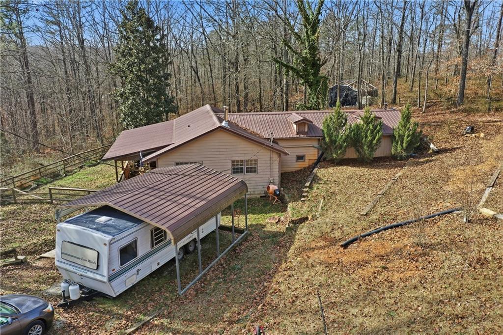 80 Beaver Run Road Waco, GA 30182 - Photo 5 of 19 a view of a house with a yard and sitting area