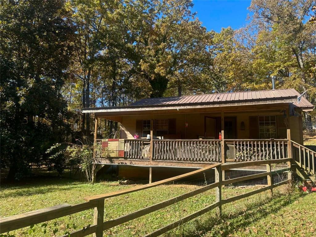 80 Beaver Run Road Waco, GA 30182 - Photo 10 of 17 a front view of a house with a yard